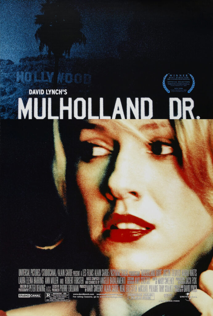 Cover for Mulholland Drive that shows a woman looking to her right and the Hollywood sign above her